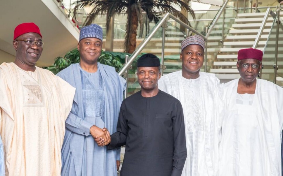 Acting president, Yemi Osinbajo in a hand shake with Senate President, Bukola Saraki