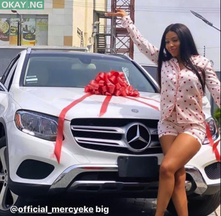 Mercy Eke poses in front of her new Mercedes Benz