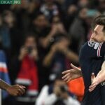 Real Madrid’s French forward Karim Benzema celebrates after Shakhtar Donetsk’s Ukrainian defender Serhiy Kryvtsov scored an own goal during the UEFA Champions League football match between Shakhtar Donetsk and Real Madrid at the Olympic Stadium in Kiev on October 19, 2021. (Photo by Sergei SUPINSKY / AFP)