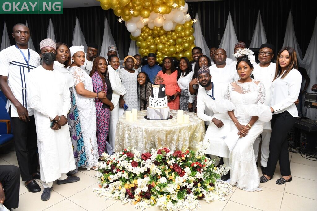 Omulu in a group picture with family, some colleagues and friends.