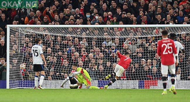 Manchester United’s Portuguese striker Cristiano Ronaldo (3R) scores his team’s third goal during the UEFA Champions league group F football match between Manchester United and Atalanta at Old Trafford stadium in Manchester, north west England, on October 20, 2021. Paul ELLIS / AFP