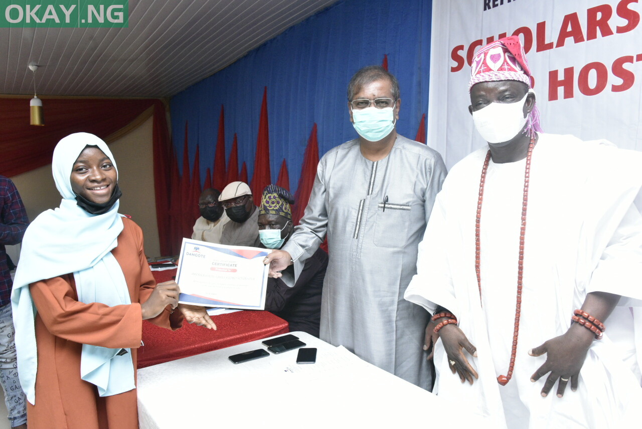 L-R, Abdulrahman Lekki Risho Yoyinsola, One of Beneficiary, Student of Lagos state University. (LASU) Group Executive Director, Strategy, Capital Projects and Portfolio Development, Dangote Industries Limited, Devakumar Edwin, HRM, Oba Olumuyiwa Ogunbekun, Onilekki of Lekki Land, at the Dangote Oil Refinery Projects and Fertilizer Limited, Presentation of Scholarship Awards Programme for the Host Communities Youth in Ibeju -Lekki, Lagos on Monday 6th December 2021