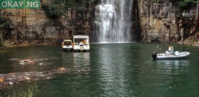 This handout picture released by Minas Gerais Fire Department shows firefighters during a rescue operation after a large rock fragment broke off a ravine and plunged onto several tourist boats, leaving at least five people dead and another 20 still missing, at the canyons of Furnas Lake, city of Capitolio, Minas Gerais state, Brazil, on January 8, 2022. AFP
