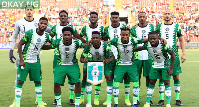 Left to Right: Nigeria’s goalkeeper Maduka Okoye, defender Kenneth Omeruo, midfielder Wilfred Ndidi, forward Taiwo Awoniyi, midfielder Joe Aribo, defender William Troost-Ekong, (bottom L-R) forward Kelechi Iheanacho, defender Ola Aina, defender Zaidu Sanusi, forward Samuel Chukwueze and forward Moses Simon pose prior to the Group D Africa Cup of Nations (CAN) 2021 football match between Nigeria and Sudan at Stade Roumde Adjia in Garoua on January 15, 2022. Daniel BELOUMOU OLOMO / AFP