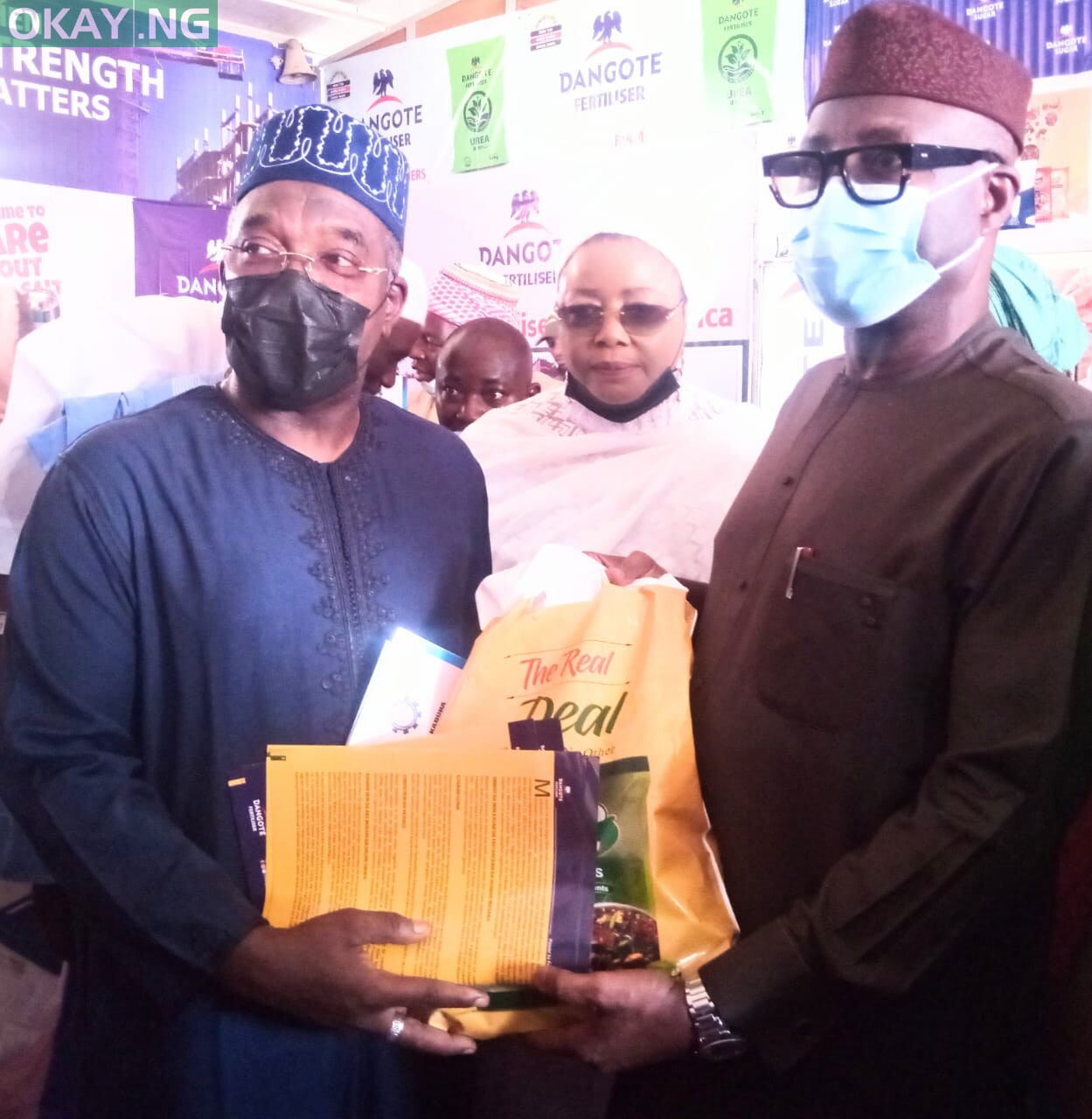 From Left: Representative of Dangote Group Alh Abdulsalam Waya, former President of KADCCIMA Hajiya Farida Muhibat Dankaka, and Minister of Industry, Trade and Investment Otunba Niyi Adebayo during the Minister's visit to the Dangote pavilion at the ongoing 43rd Kaduna International Trade Fair