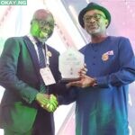 NLNG's GM, Production, Adeleye Falade, receives the award on behalf of the company.