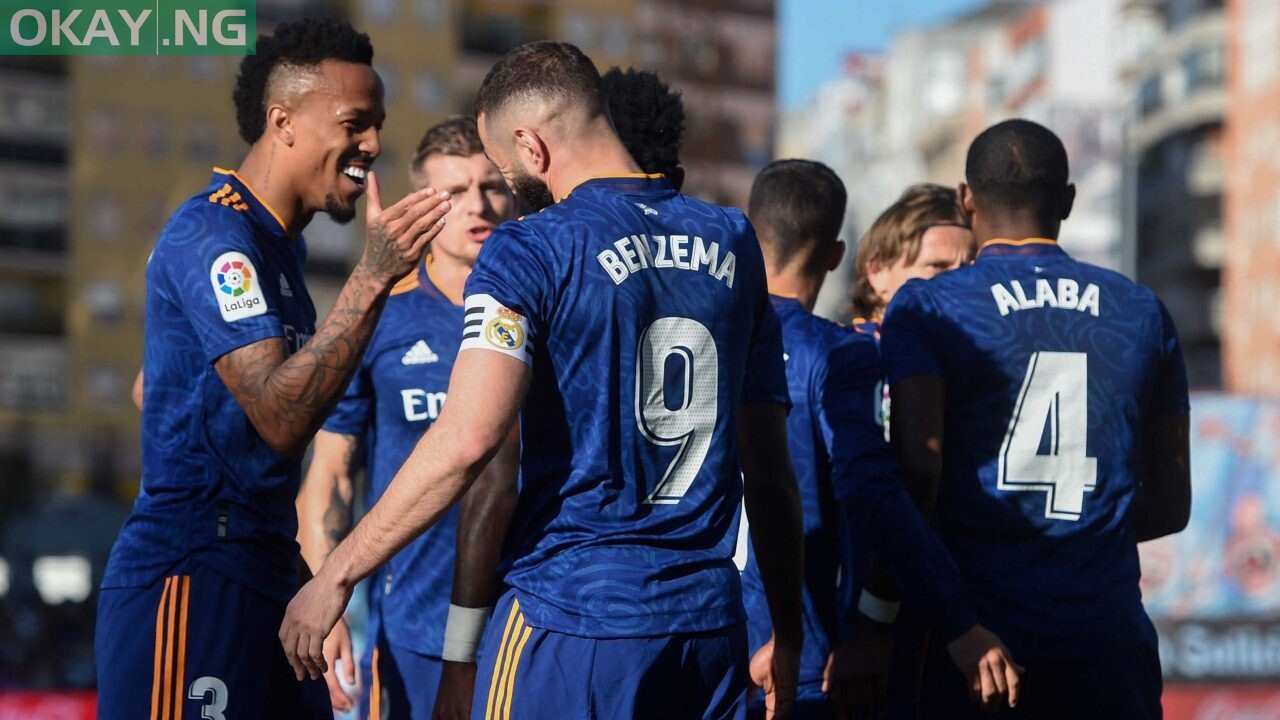 Real Madrid’s French forward Karim Benzema (R) celebrates with teammates during the Spanish League football match between RC Celta de Vigo and Real Madrid CF at the Balaidos stadium in Vigo on April 2, 2022. (Photo by MIGUEL RIOPA / AFP)