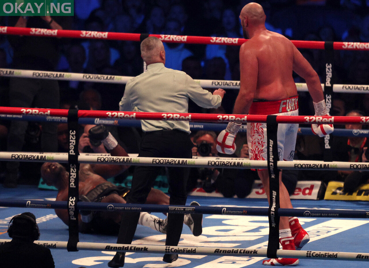 Britain’s Tyson Fury (R) knocks out Britain’s Dillian Whyte in the sixth round to win their WBC heavyweight title fight at Wembley Stadium in west London, on April 23, 2022. – Tyson Fury stopped British rival Dillian Whyte in the sixth round to retain his WBC heavyweight crown at a packed Wembley on Saturday. In his first fight on UK soil in four years, Fury was treated to a hero’s welcome by a 94,000-capacity crowd and largely dictated the tempo before ending proceedings in devastating fashion. (Photo by Adrian DENNIS / AFP)