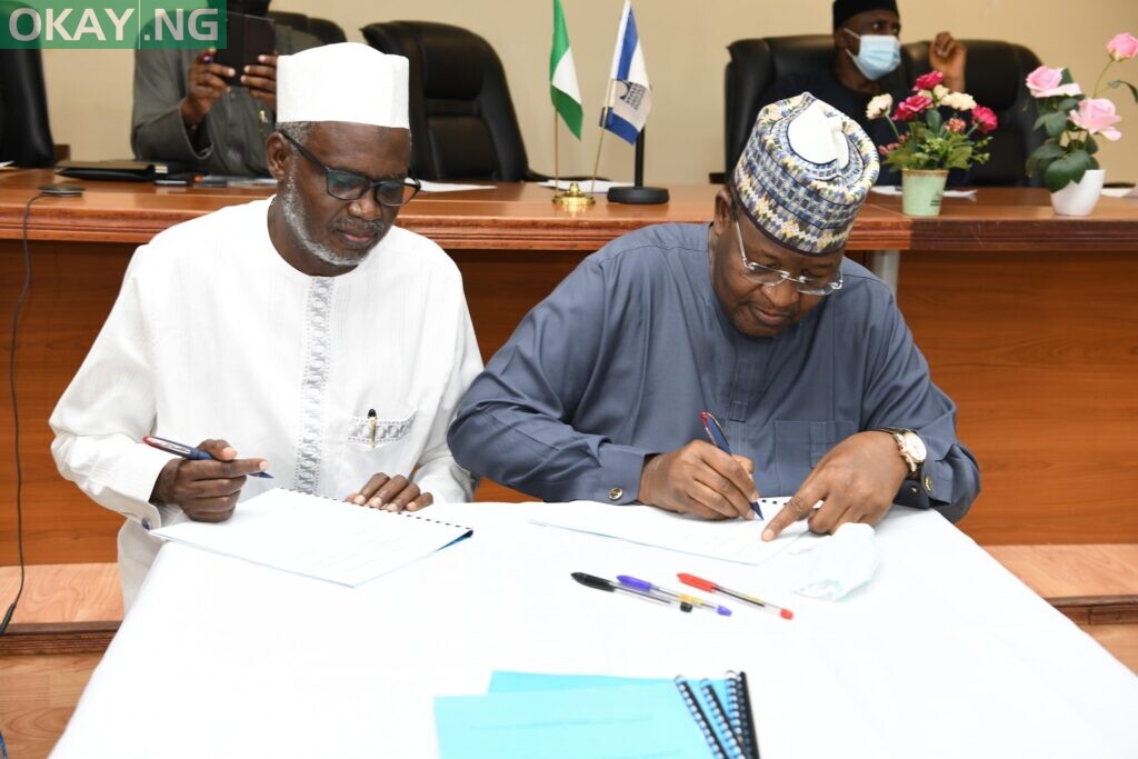 Prof.Bilbis and Prof. Danbatta signing a MoU at the event.