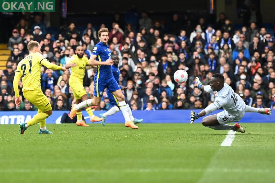 Brentford’s Danish midfielder Christian Eriksen scores past Chelsea’s French-born Senegalese goalkeeper Edouard Mendy (R) during the English Premier League football match between Chelsea and Brentford at Stamford Bridge in London on April 2, 2022. Glyn KIRK / AFP