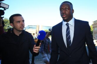Manchester City and France footballer Benjamin Mendy (R) arrives to Chester Crown Court in northwest England on August 10, 2022 at the start of his trial for the alleged rape and assault of seven women. Mendy, 28, who faces eight counts of rape, one count of sexual assault and one count of attempted rape, relating to seven young women, could see his playing career end in jail if convicted. (Photo by Lindsey Parnaby / AFP)