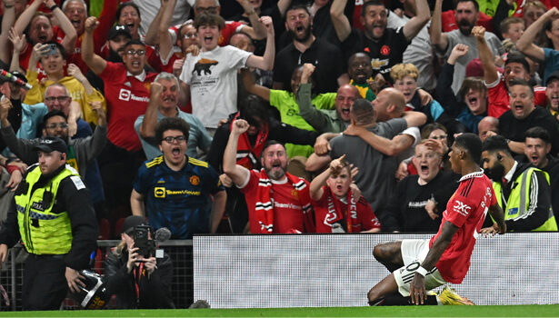Manchester United’s English striker Marcus Rashford (R) celebrates in front of supporters after scoring their second goal during the English Premier League football match between Manchester United and Liverpool at Old Trafford in Manchester, north west England, on August 22, 2022. (Photo by Paul ELLIS / AFP)