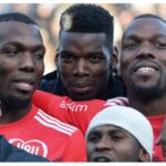 In this file photo taken on December 29, 2019, the Pogba brothers, Manchester United and France midfielder Paul Pogba (C), Atlanta United defender Florentin Pogba (L), and CD Manchego midfielder Mathias Pogba (R), pose prior to a gala football match between All-Star France and Guinea at the Vallee du Cher Stadium in Tours, central France, as part of the “48h for Guinea” charity event. Photo by GUILLAUME SOUVANT / AFP)