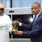 The Honourable Minister of Transportation, Engr. Mu'azu Jaji Sambo (left) receiving a souvenir from the Director General, Nigerian Maritime Administration and Safety Agency, NIMASA, Dr Bashir Jamoh during a visit by the Honourable Minister to the NIMASA headquarters in Lagos.