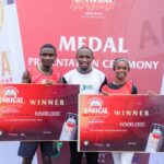 Chinecherem Kingsley Onyia, Winner(male category), Enugu Amstel Ultra Marathon; Chidi Egwu, Senior Marketing Manager, Amstel Malta; Affigbo Esther, Winner (female category), Enugu Amstel Ultra Marathon at the Medal presentation ceremony, Nnamdi Azikiwe stadium, Enugu.