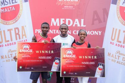 Chinecherem Kingsley Onyia, Winner(male category), Enugu Amstel Ultra Marathon; Chidi Egwu, Senior Marketing Manager, Amstel Malta; Affigbo Esther, Winner (female category), Enugu Amstel Ultra Marathon at the Medal presentation ceremony, Nnamdi Azikiwe stadium, Enugu.
