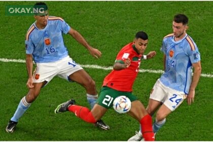 Morocco’s midfielder #21 Walid Cheddira fights for the ball with Spain’s midfielder #16 Rodri and Spain’s defender #24 Aymeric Laporte during the Qatar 2022 World Cup round of 16 football match between Morocco and Spain at the Education City Stadium in Al-Rayyan, west of Doha on December 6, 2022. (Photo by MANAN VATSYAYANA / AFP)