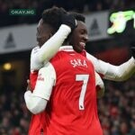 Eddie Nketiah (L) and Bukayo Saka (R) of Arsenal celebrate Nketiah's game-winning goal during the Premier League match against Manchester United at the Emirates Stadium on January 22, 2023. (Photo by Glyn KIRK / AFP)