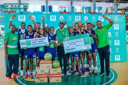 Category Manager for Beverages, Nestlé Nigeria, Mr. Olutayo Olatunji (middle) presenting the winner’s trophy to the girls from St. Jude’s Girls Secondary School Amarata Yenagoa, Bayelsa State at the Indoor Sports Hall of the Stephen Keshi Stadium Asaba recently after the girls won the girls category of the Atlantic Conference of the 23rd MILO Secondary Schools Basketball Championship