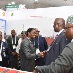 At the ongoing Practical Nigerian Content Conference & Exhibition in Yenagoa, Bayelsa State… Shell Companies in Nigeria General Manager Nigeria Content, ‘Lanre Olawuyi, welcome the minister of state for Petroleum Resources (Oil), Heineken Lokpobiri to the Exhibition Booth of Shell.