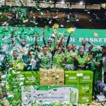 Boladale Odunlami, Commercial Manager, Nestlé Nigeria; Olabisi Joseph, President, Nigeria School Sports Federation (NSSF); and Ifeanyichukwu Orabuche, Category Manager, Beverages, Nestlé Nigeria, pose with the triumphant Father O’Connell Science College team after they clinched the male championship title at the 25th MILO Basketball Championship held at the Indoor Sports Hall, National Stadium, Lagos.