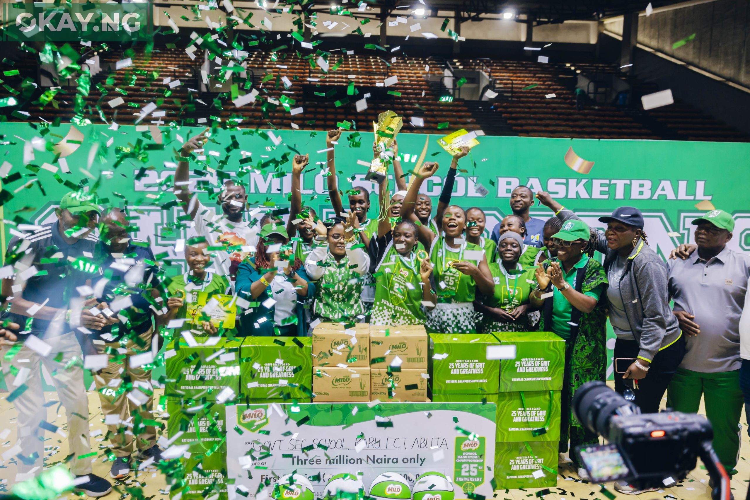 Boladale Odunlami, Commercial Manager, Nestlé Nigeria; Olabisi Joseph, President, Nigeria School Sports Federation (NSSF); and Ifeanyichukwu Orabuche, Category Manager, Beverages, Nestlé Nigeria, pose with the triumphant Father O’Connell Science College team after they clinched the male championship title at the 25th MILO Basketball Championship held at the Indoor Sports Hall, National Stadium, Lagos.