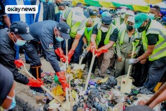 Lagos Governor Babajide Sanwo-Olu and Deputy Governor Obafemi Hamzat join officials in a symbolic street cleaning exercise to mark the return of Lagos State's monthly environmental sanitation exercise, which resumes fully on April 25 after a nine-year suspension.