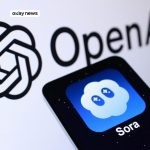 A smartphone showing the Sora app icon placed in front of the OpenAI logo on a white background.