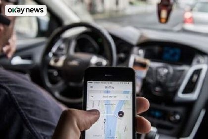 File Photo: Passenger operating the UBER app while on a ride