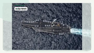 A US Navy handout photo shows the Nimitz-class aircraft carrier USS George H.W. Bush sailing in the Arabian Sea.